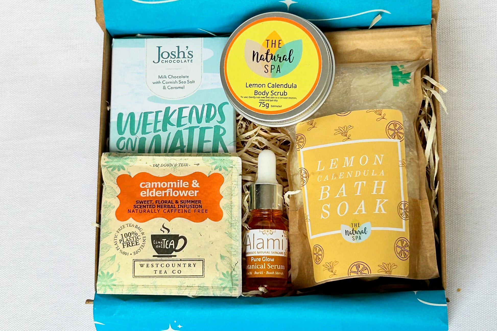 Pamper Hamper Gift Set from Sand & Sparkle with all natural skincare products including bath soak, body scrub, luxurious facial oil, artisan chocolate and herbal tea from Devon and Cornish artisans
