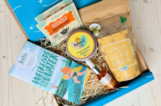 Pamper Hamper Gift Set from Sand & Sparkle with all natural skincare products including bath soak, body scrub, luxurious facial oil, artisan chocolate and herbal tea from Devon and Cornish artisans