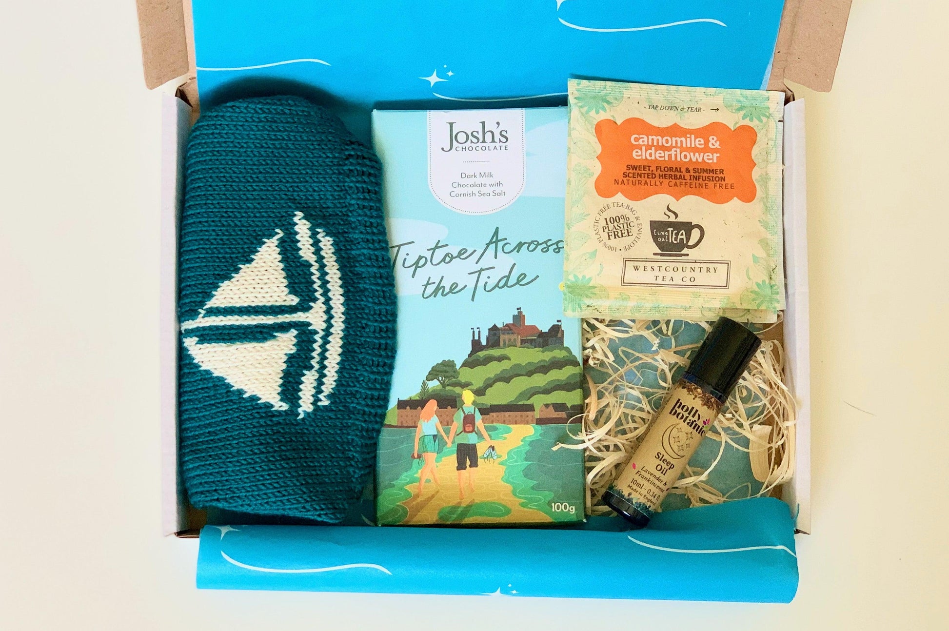 New Mum Letterbox Gift Set with Cornish merino baby beanie, Cornish chocolate, Cornish herbal tea and Devon made aromatherapy sleep oil